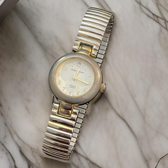 Sergio Valente Accessories - Vintage Sergio Valente Diamond Quartz Wristwatch, stretch wristband Running well